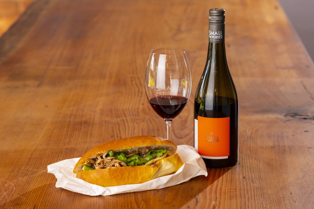 Small Victories Grenache food pairing with Banh mi on table