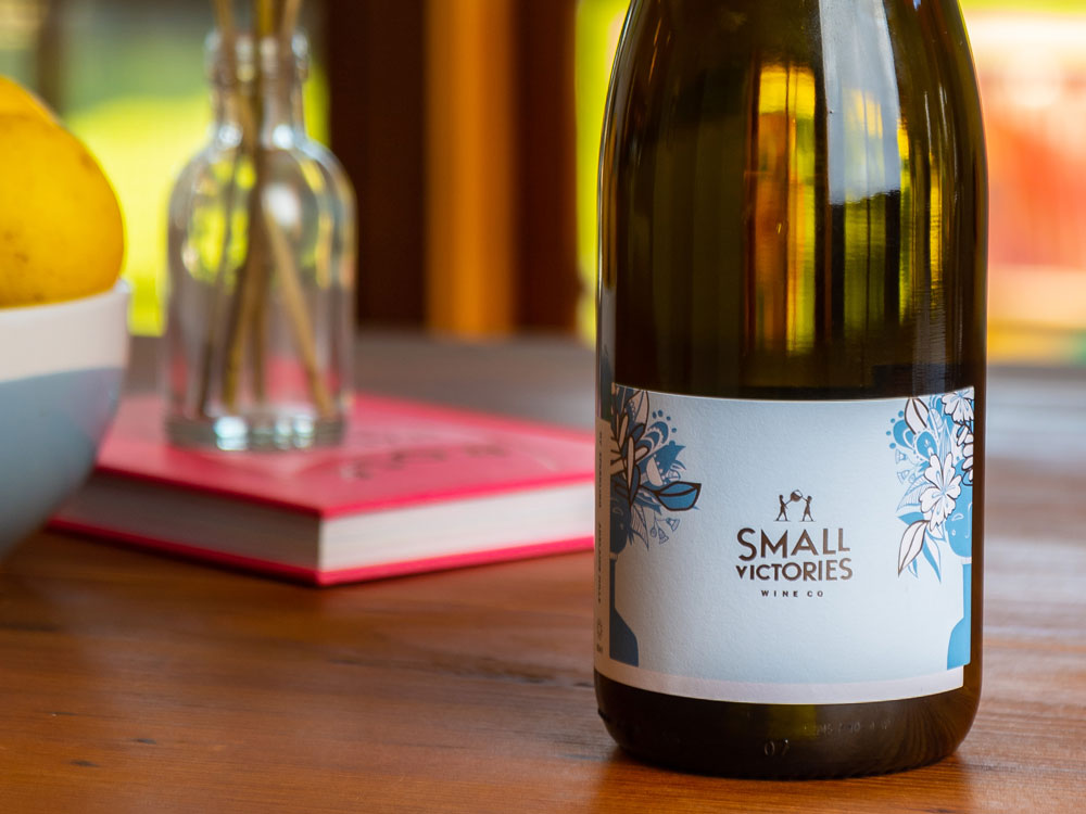 Small Victories Sparkling wine with wine label artwork by Leah Grant